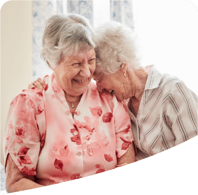 two women smiling at each other