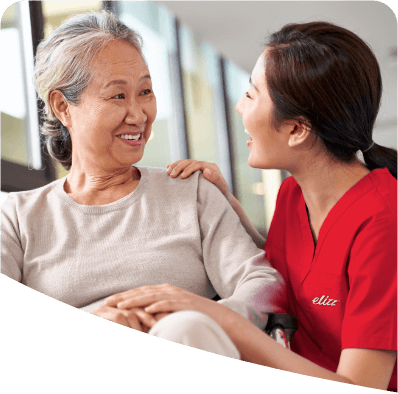 Nurse smiling at elderly patient